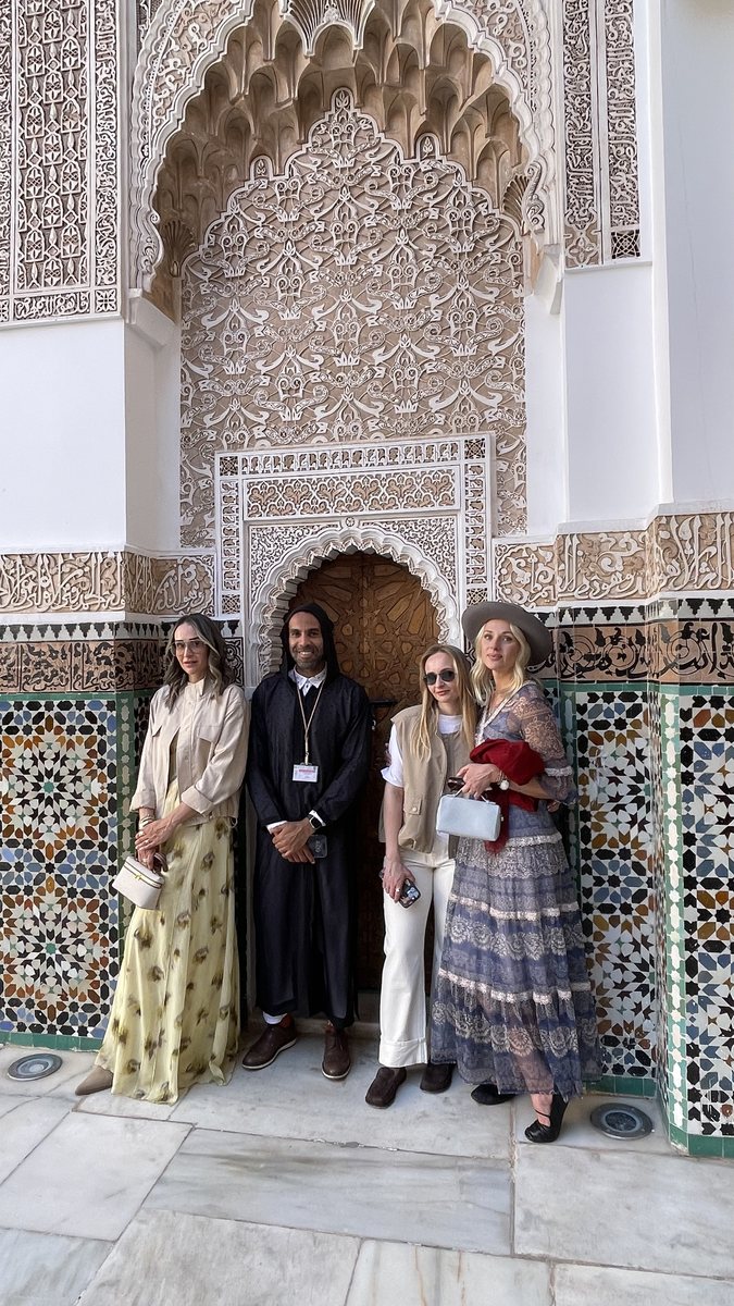 Travelers at a Moroccan palace entry