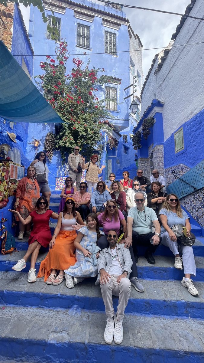 Group photo on blue Moroccan stairs